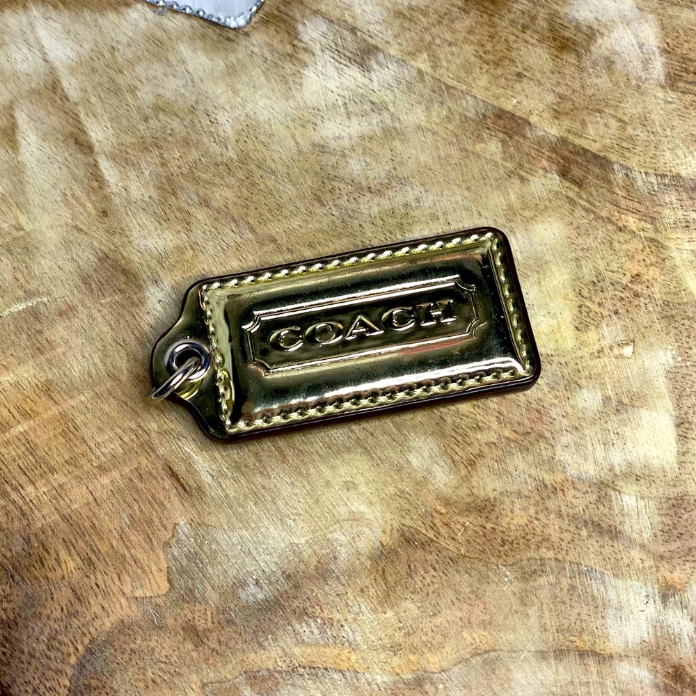 Gold shiney new Coach tag